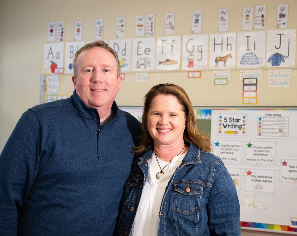 Shane and Sheila Kohl in a classroom at Foster Elementary School.