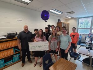 Appleton West educator and students celebrate receiving an AEF grant.